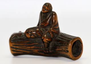 Gyokko signed lumberjack rest on a tree netsuke Edo period