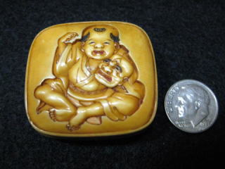 AKAEBISUDO TANAGOKORO,HOJITSU SIGNED MANJYU NETSUKE CHINESE BOY PLAYS MASK OF OLD MEN JPG01