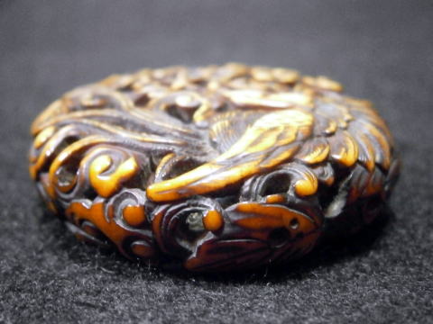 AKAEBISU-DOU PAGE OF RYUSA MANJYU NETSUKE FIGURE OF PHOENIX SIDE VIEW 2